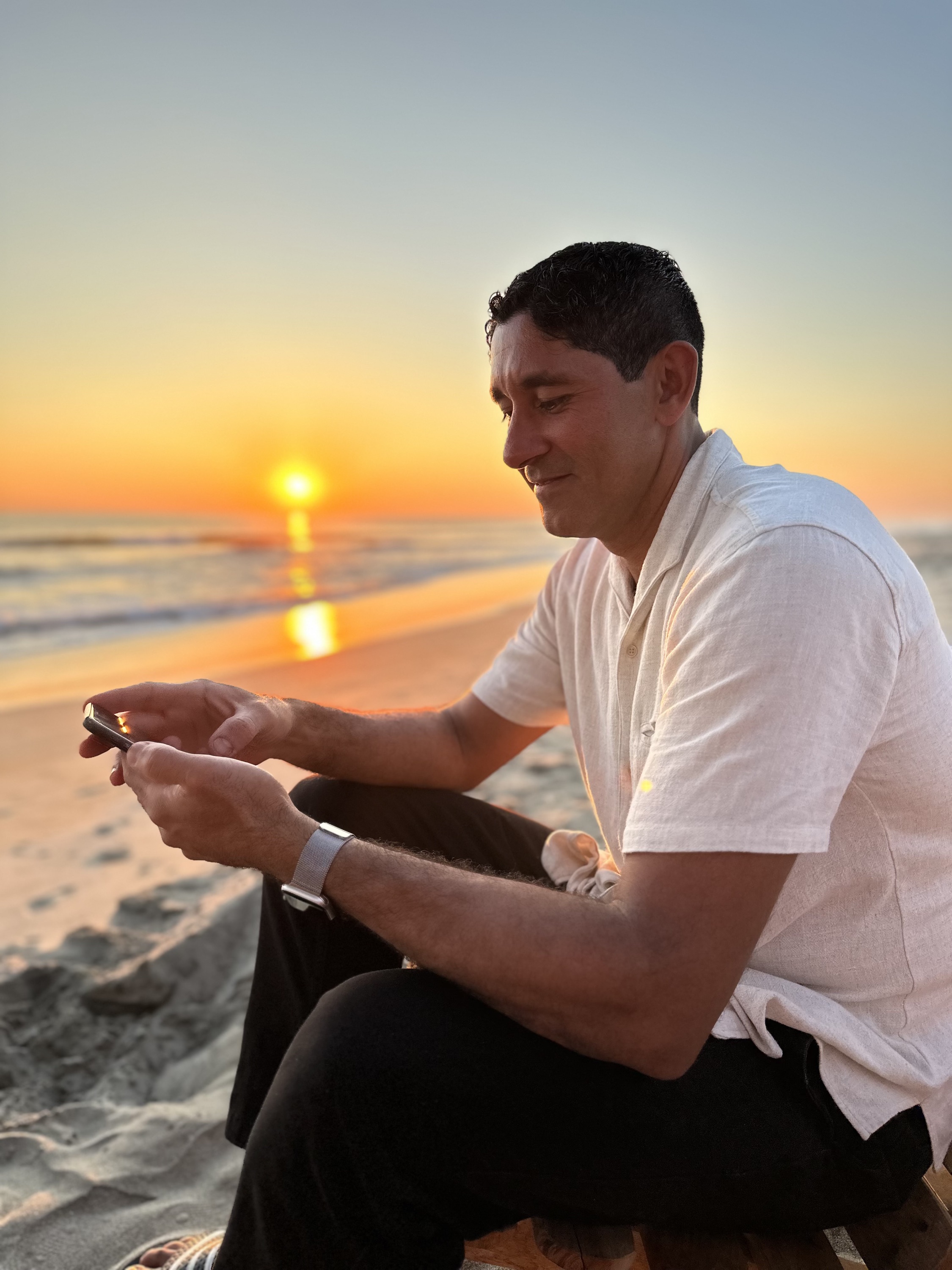 Leo Estevez on the beach at sunset